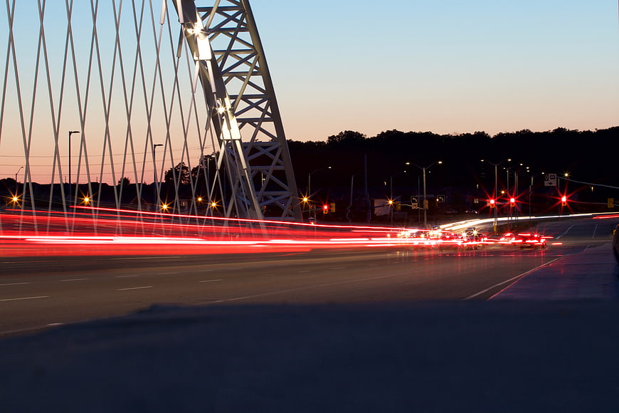 Long Exposure Traffic Light Trails on Modern Cable-Stayed Bridge at Dusk