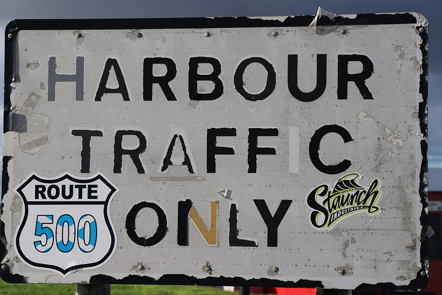 Weathered Harbour Traffic Only Road Sign with Stickers