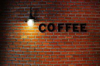 Coffee Sign on Brick Wall with Lamp