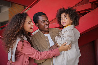 Happy African American Family Portrait on Red Stairs