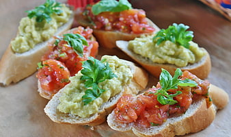 Fresh Bruschetta with Tomato and Avocado Toppings on Baguette Slices