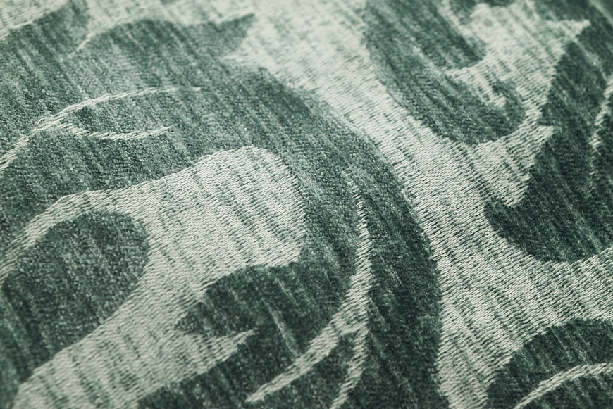 Close-up of green floral woven fabric texture