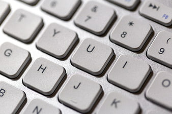 Close-up of white laptop keyboard keys