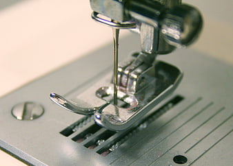 Close-up of sewing machine needle and presser foot mechanism