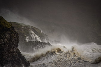 Dramatic Storm Waves Crashing Against Cliffs in Ireland