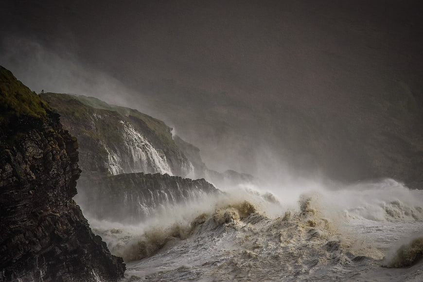 Dramatic Storm Waves Crashing Against Cliffs in Ireland
