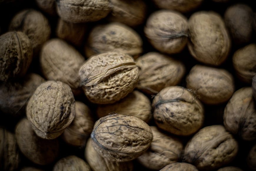 Close-up of whole walnuts with textured shells