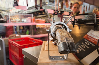 Close-up of animal hoof in butcher shop meat grinder
