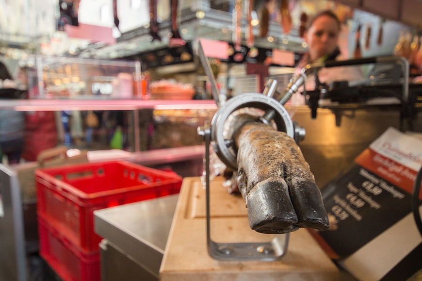 Close-up of animal hoof in butcher shop meat grinder