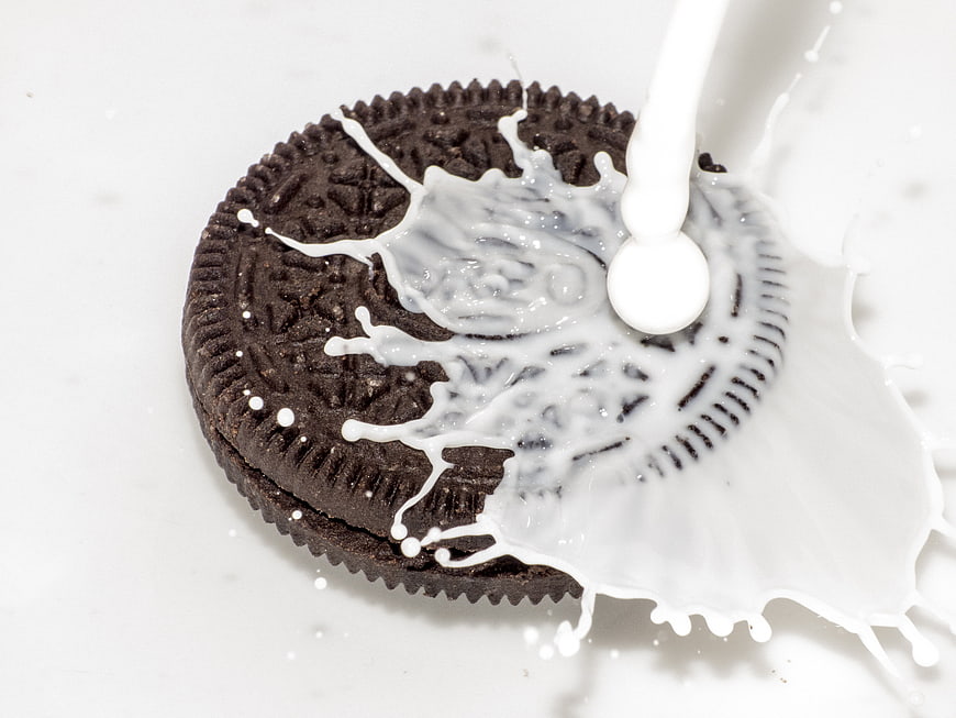 Chocolate Cookie With Milk Splash On White Background