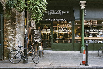 Bread Ahead Bakery School storefront with bicycle and chalkboard sign