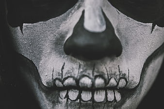 Close-up of skull makeup on a man's face