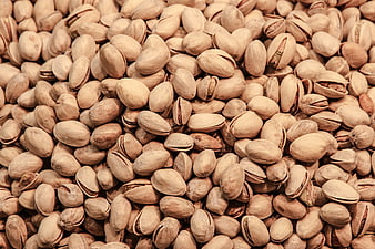 Close-up texture of roasted pistachio nuts in shell
