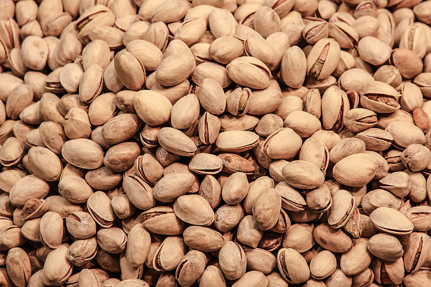 Close-up texture of roasted pistachio nuts in shell