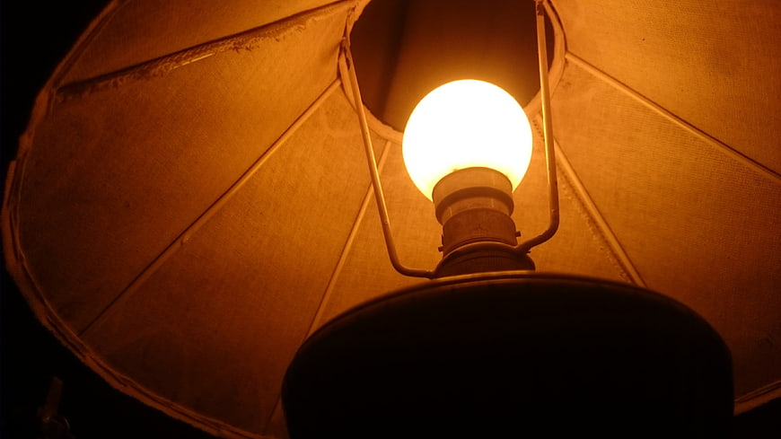Glowing Vintage Lamp Bulb Inside Fabric Shade