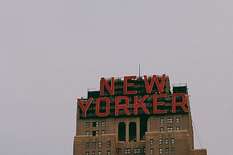 New Yorker Hotel Sign on Overcast Sky