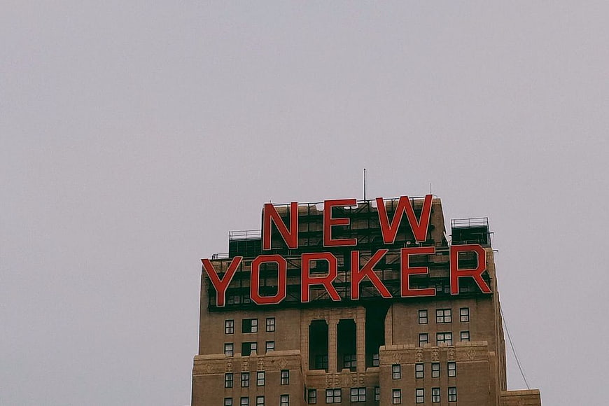 New Yorker Hotel Sign on Overcast Sky