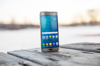 Samsung Galaxy S7 Edge Smartphone on Wooden Surface