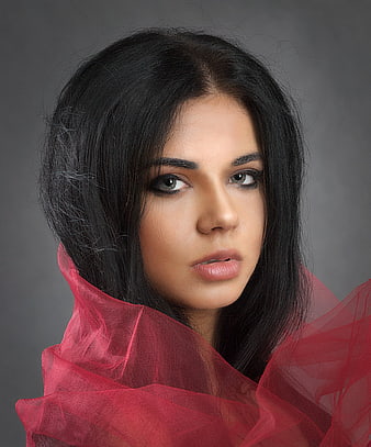 Studio Portrait of Young Woman With Red Tulle