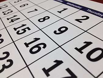 Close-up of a monthly calendar page with dates and days