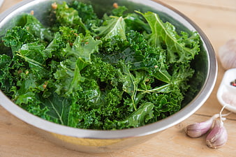 Fresh Green Kale Salad In Stainless Steel Bowl With Garlic