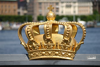 Golden Crown Sculpture on Bridge Railing in Stockholm