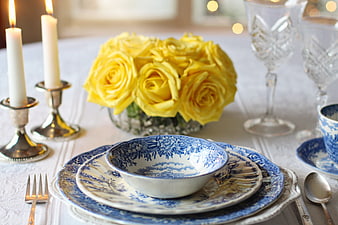 Elegant Blue and White Vintage Table Setting with Yellow Roses