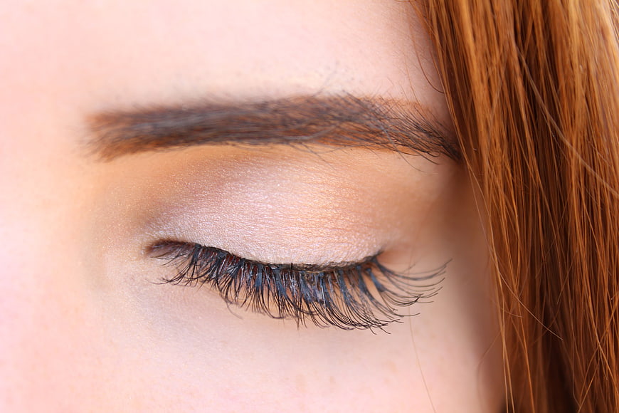 Close-Up of Closed Eye With Shimmer Eyeshadow and Long Lashes