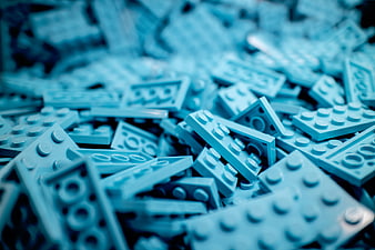 Close-up of scattered blue building blocks with shallow depth of field