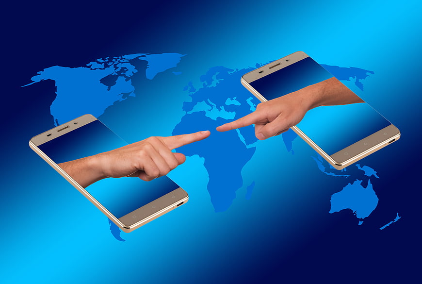Smartphones Connecting Hands Over World Map Background