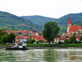 Weissenkirchen town view with church and river landscape