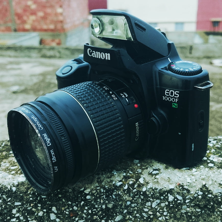 Vintage Canon EOS 1000F Film Camera on Concrete