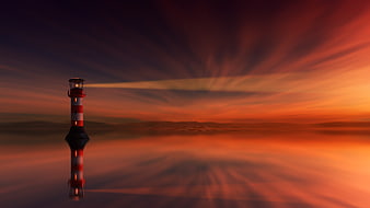 Lighthouse Reflection in Dramatic Orange Sunset Sky