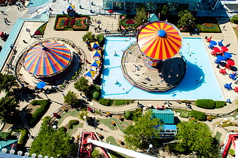 Aerial View of Colorful Amusement Park with Carousel and Pool