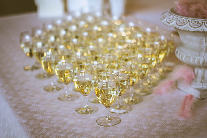 Rows of champagne glasses on a wedding table