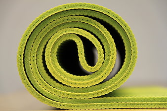 Close-up of Rolled Green Yoga Mat Texture