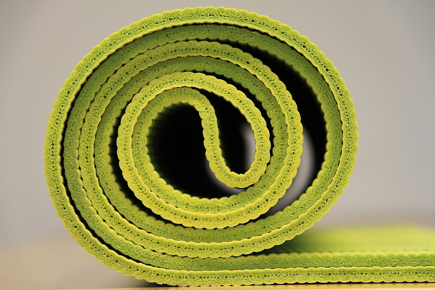 Close-up of Rolled Green Yoga Mat Texture