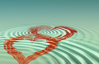 Abstract red heart reflection in rippling turquoise water surface