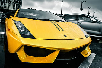 Yellow Lamborghini Murcielago Front View in Rainy Urban Setting