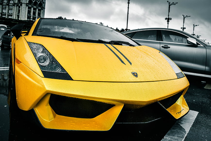Yellow Lamborghini Murcielago Front View in Rainy Urban Setting