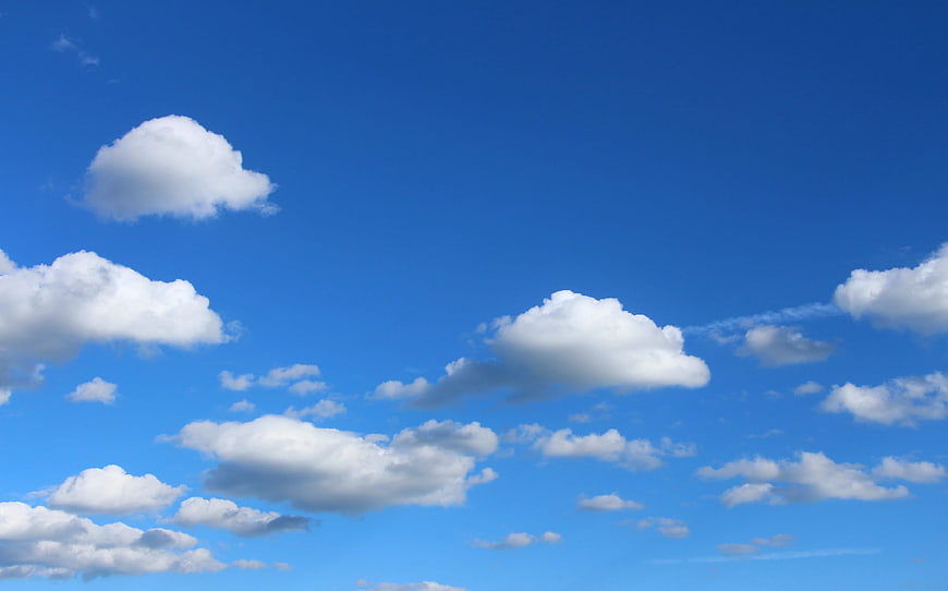 Blue Sky With Fluffy White Clouds