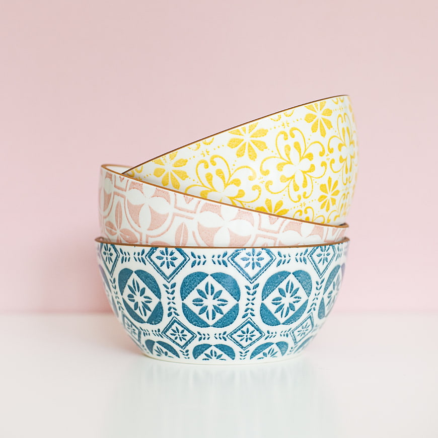 Stacked Patterned Ceramic Bowls on Pink Background