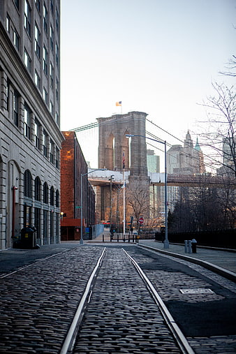Cobblestone street leading to Brooklyn Bridge in New York City