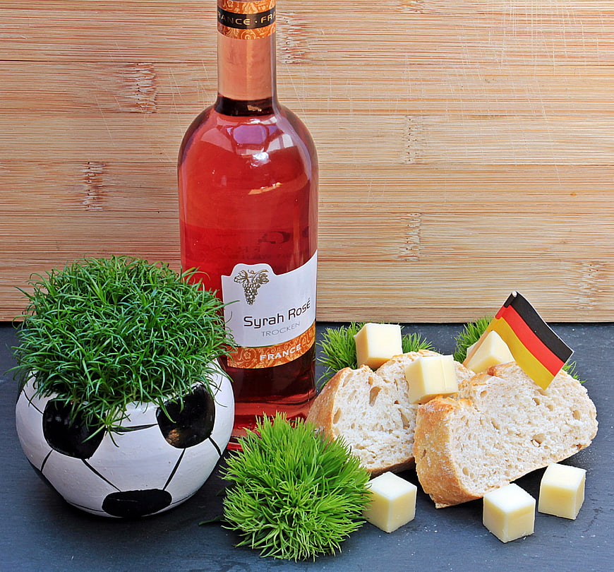 Creative Soccer Themed Still Life With Wine, Bread, Cheese, And German Flag