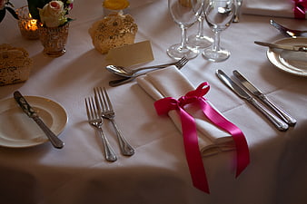 Elegant Wedding Table Setting with Pink Ribbon Napkin