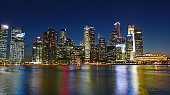 Singapore Skyline at Night with Water Reflections