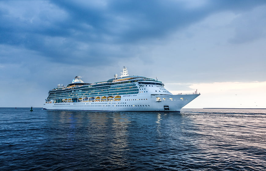 Serenade of the Seas cruise ship on calm water under dramatic sky