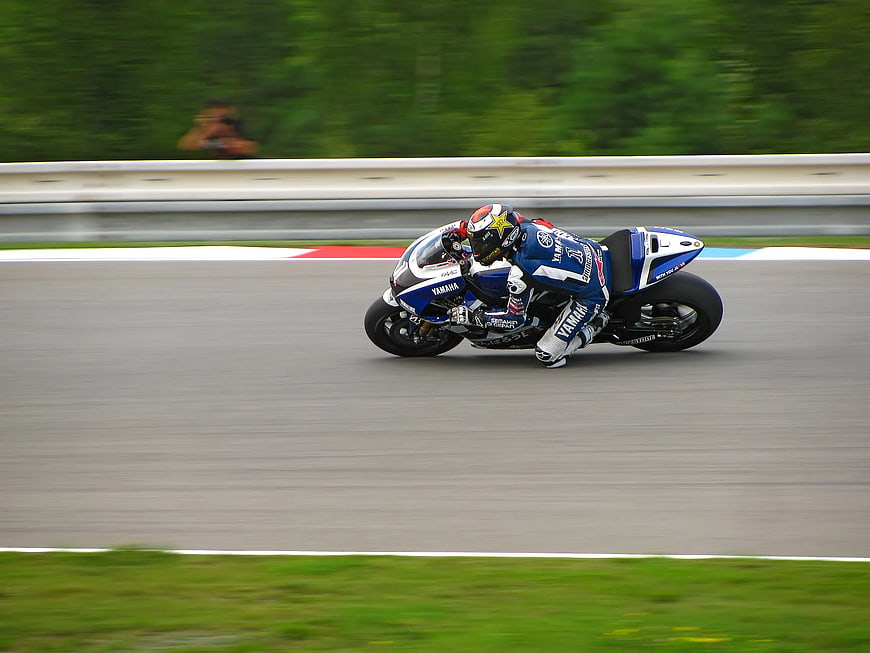 Motorcyclist Racing on Track