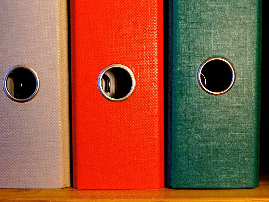 Colorful Ring Binders on Wooden Shelf