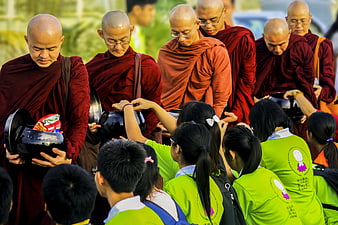 Buddhist Monks Receiving Alms from Laypeople